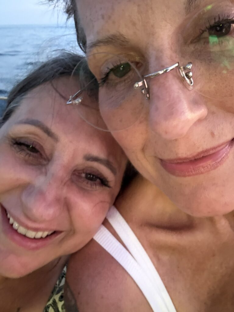 Lisa and her sister smiling – warm, personal connection on the contact page