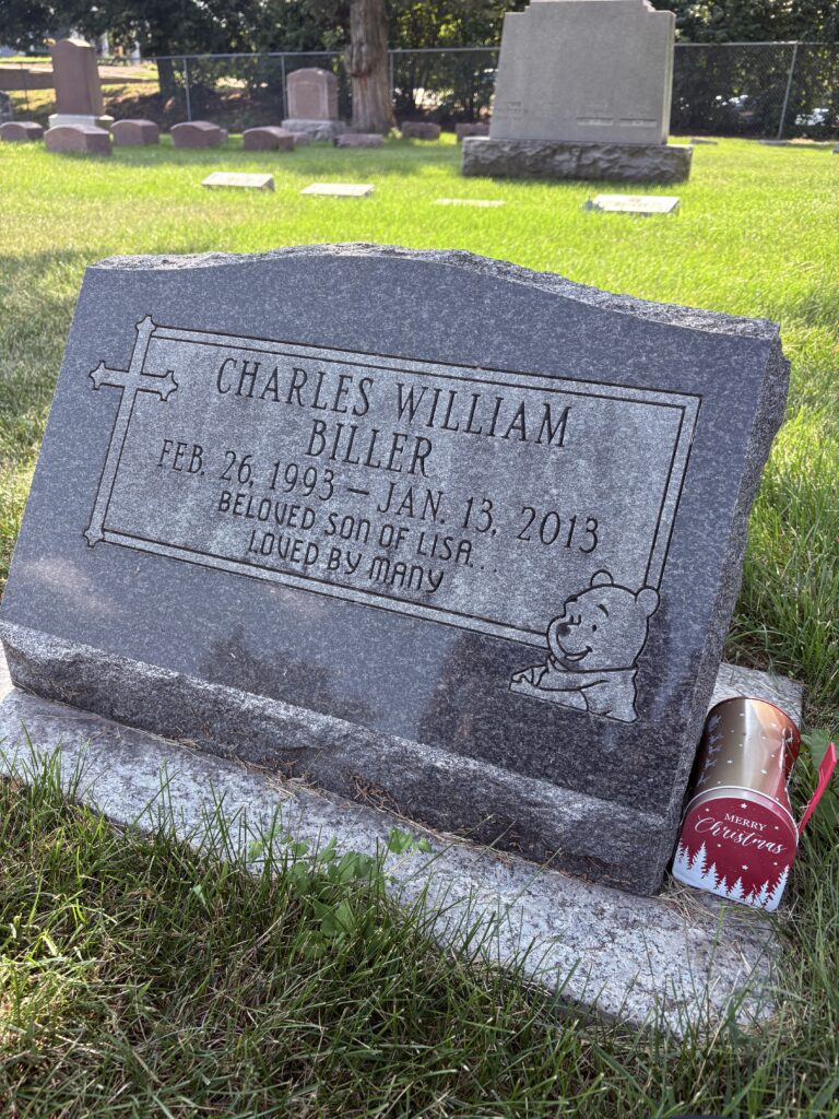 Headstone of Charlie with a small memorial mailbox beside it, symbolizing love and remembrance — connected to “A Christmas Letter Found in August.