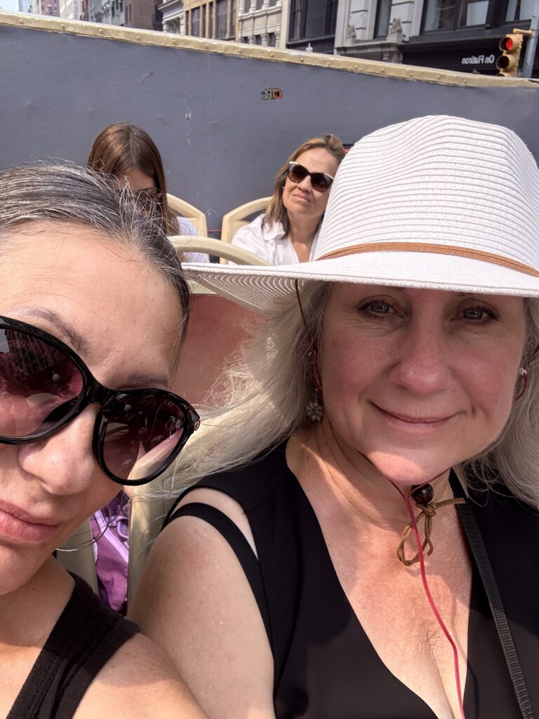 Sitting on the top deck of the Big Bus Tour in New York City.