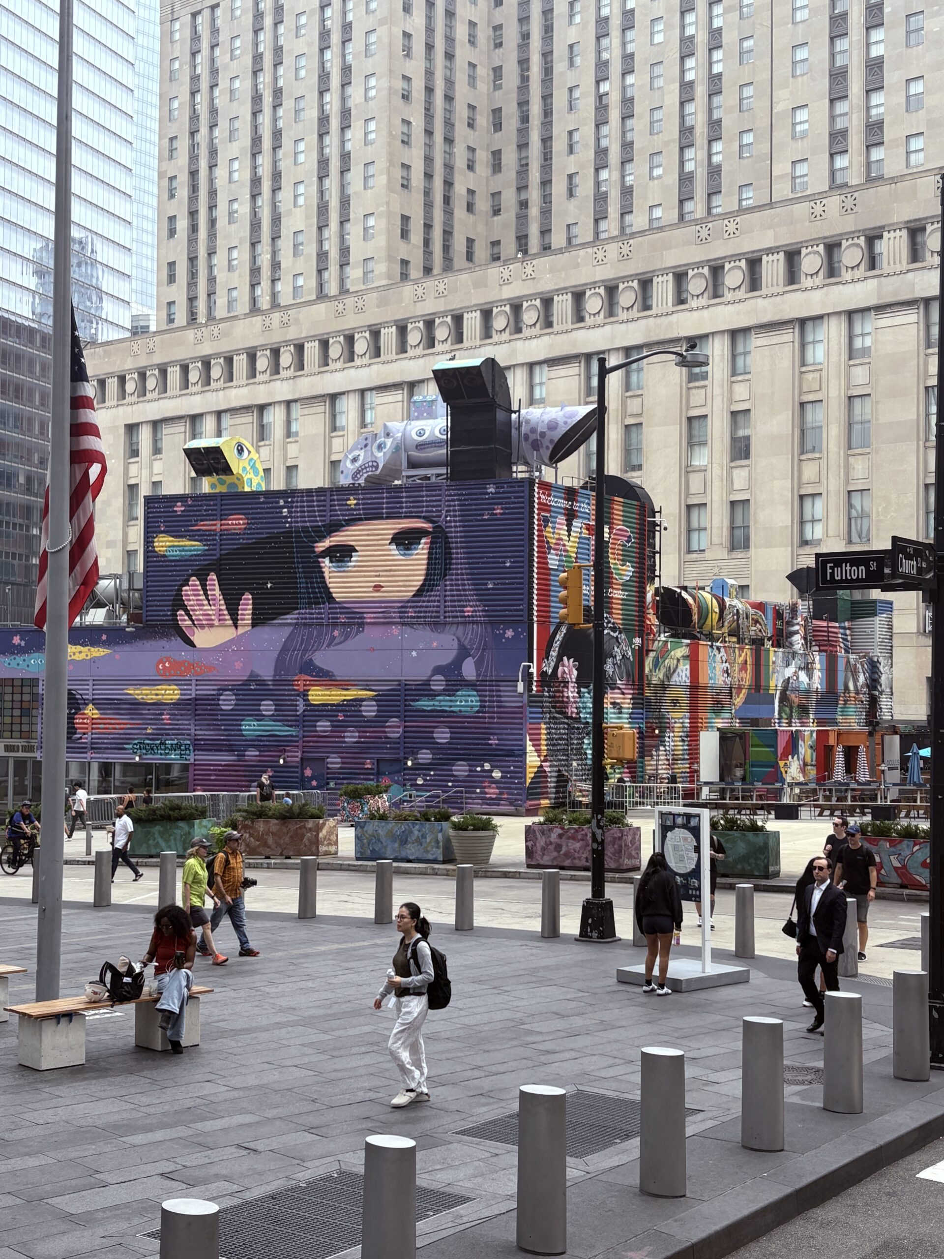 Colorful mural painted on a city building wall in New York.