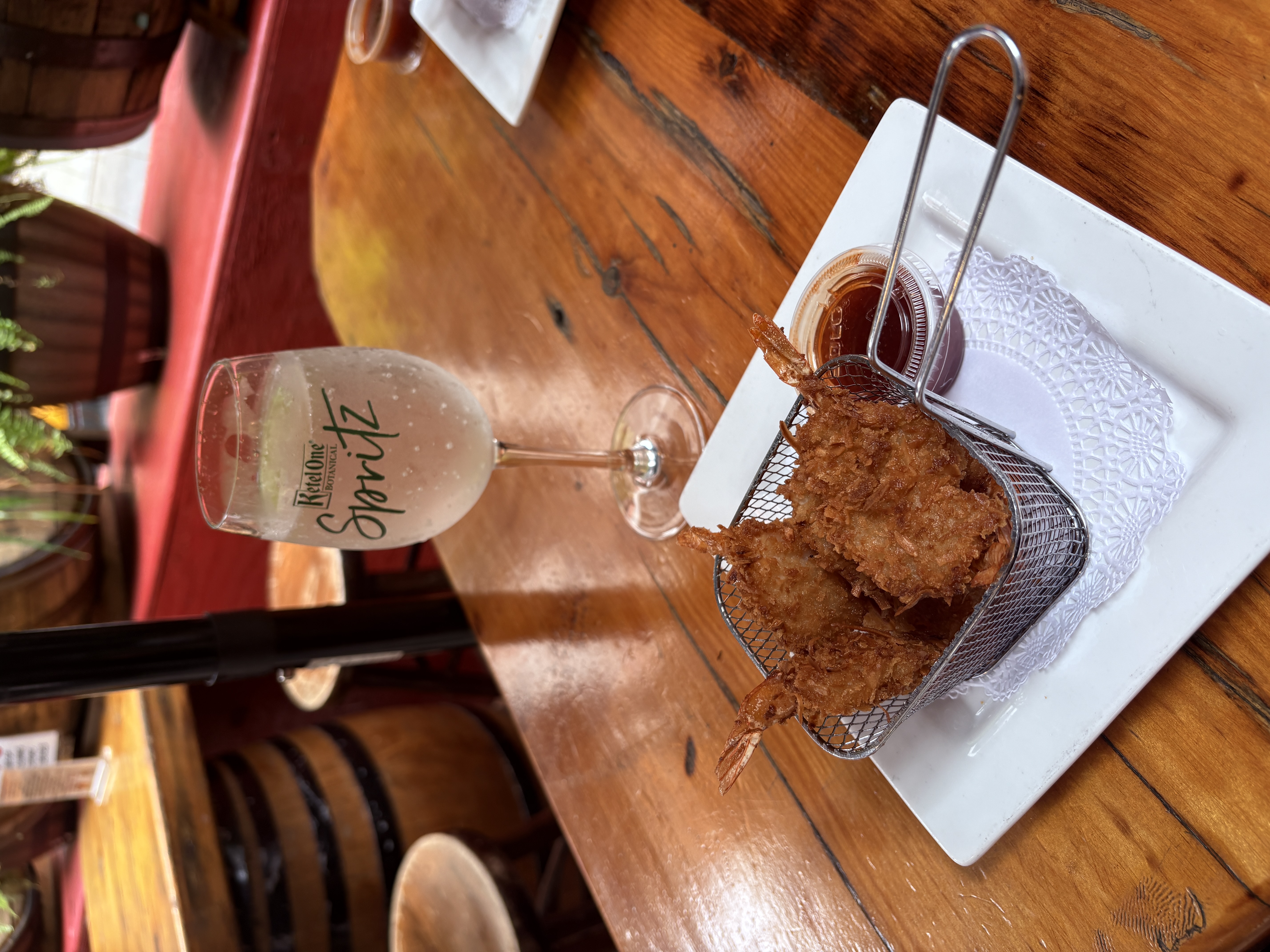 Plate of coconut shrimp and a spritz cocktail at Playwright Celtic Pub in New York.
