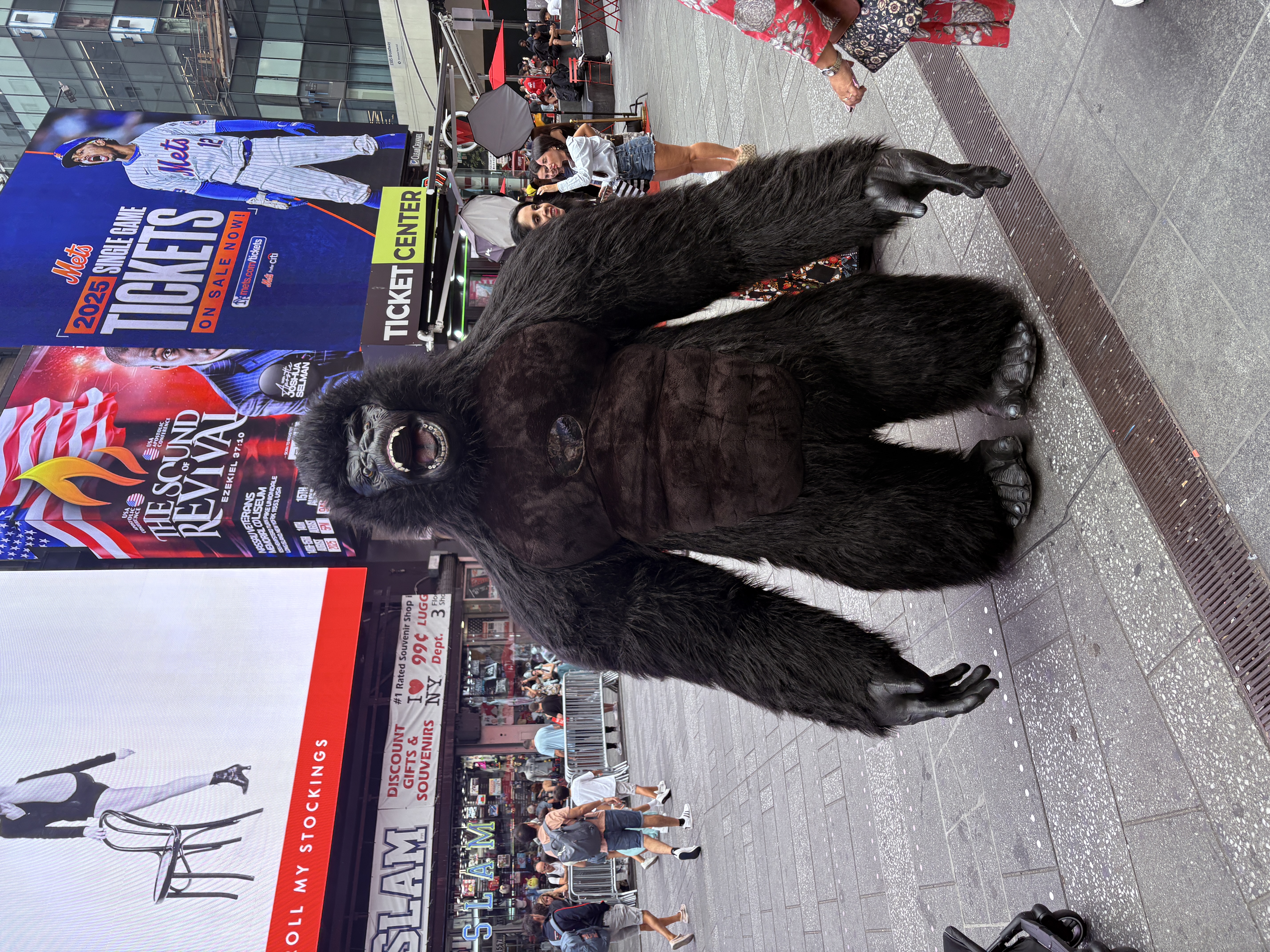 Gorilla character in the middle of Times Square with billboards in the background.