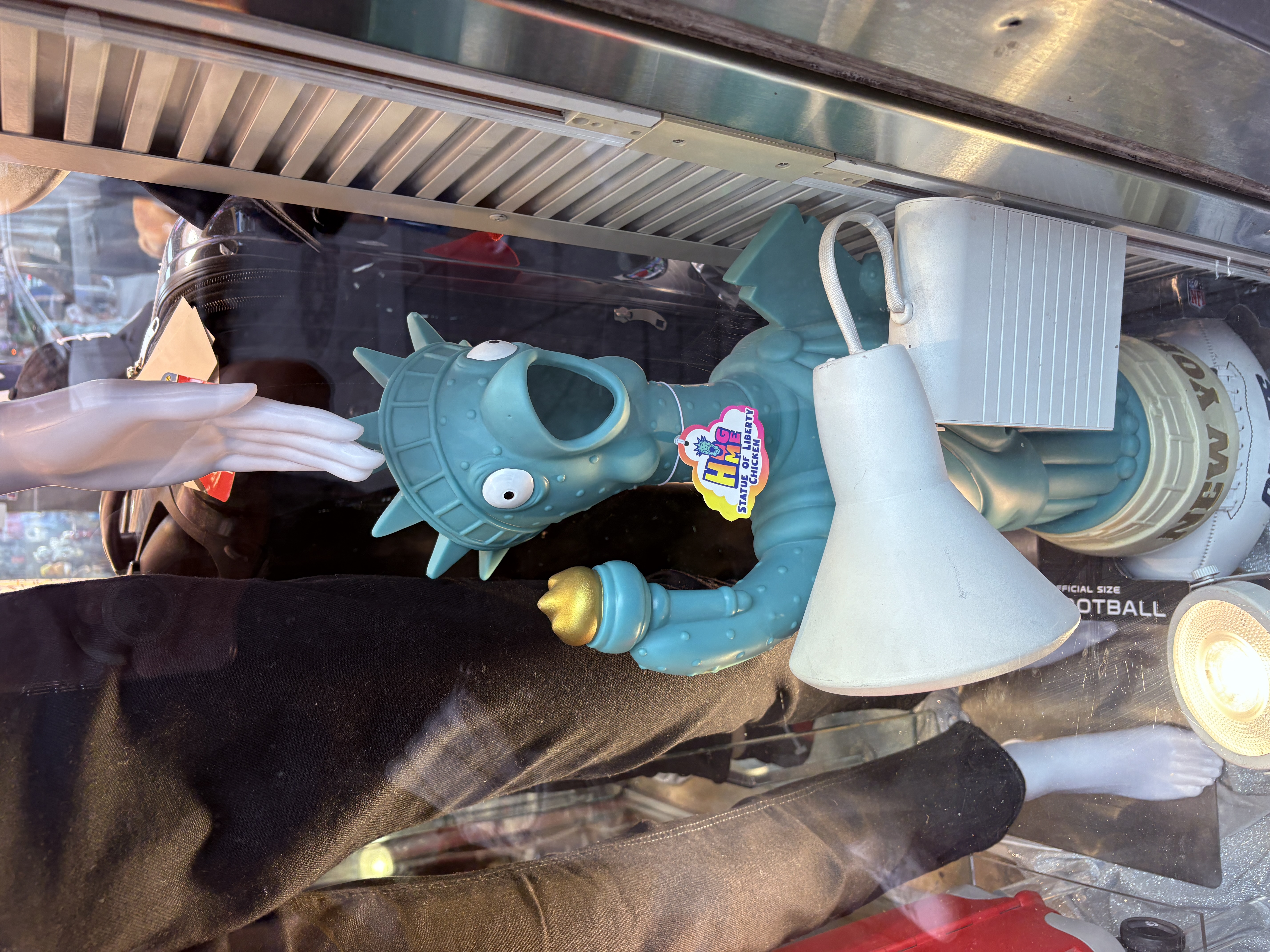 Statue of Liberty–themed chicken lamp in a shop window in Times Square.