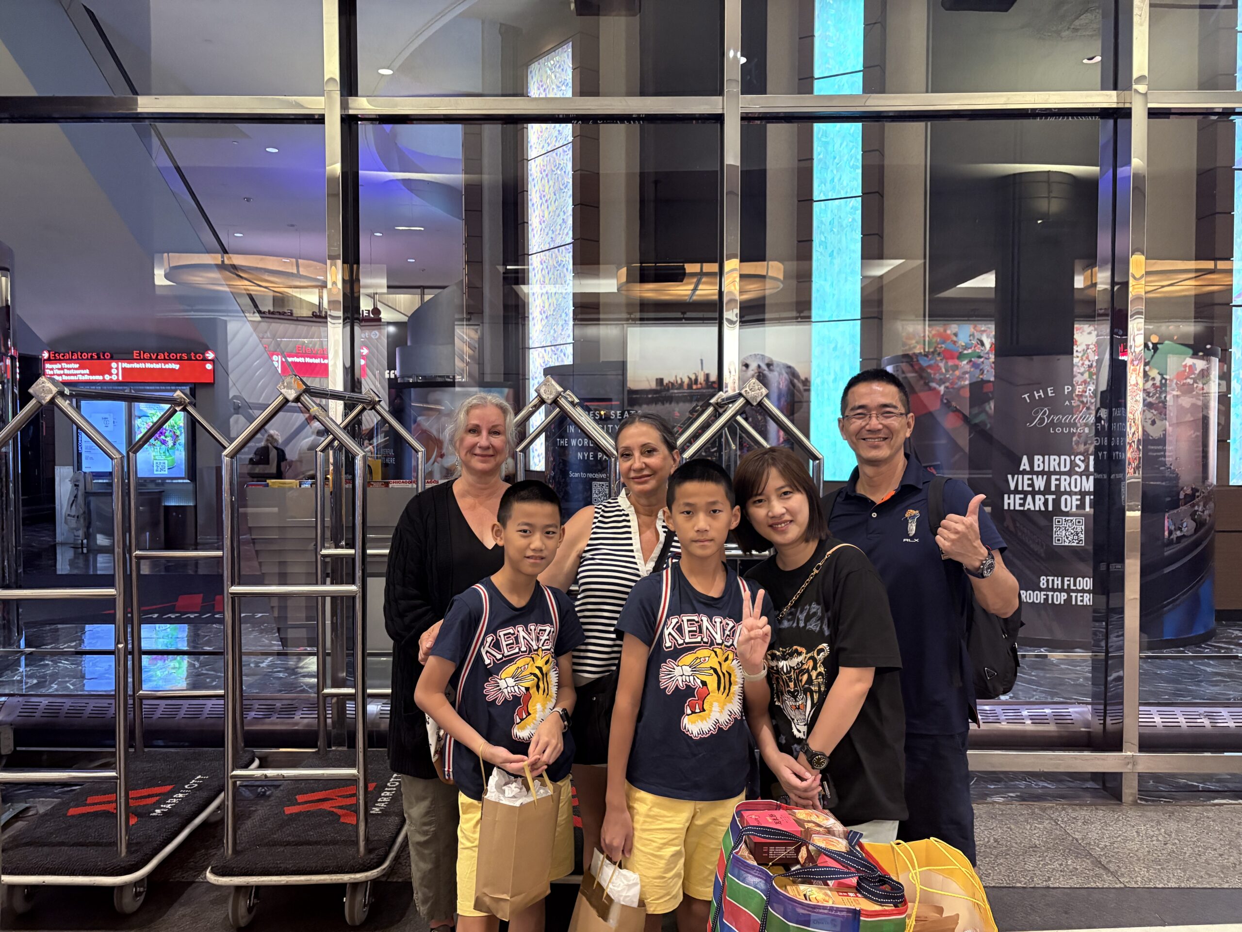 Life in Pictures New York Day 4 – Lisa, Cora, William, and Victor with their parents in the hotel entrance.
